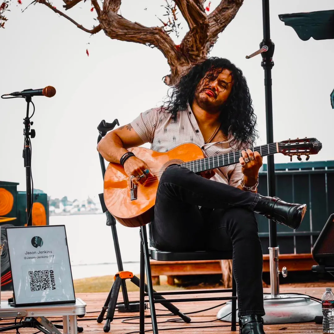 Jason Jenkins playing the guitar
